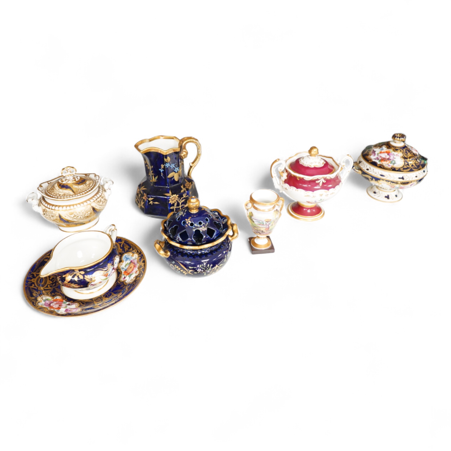 A Group of early 19th century English porcelain; to sauce tureens and covers, one with stand, a covered sugar bowl, a two handled vase, a pot pourri vase and cover, a milk jug and a hydra shaped jug, largest 16cm high